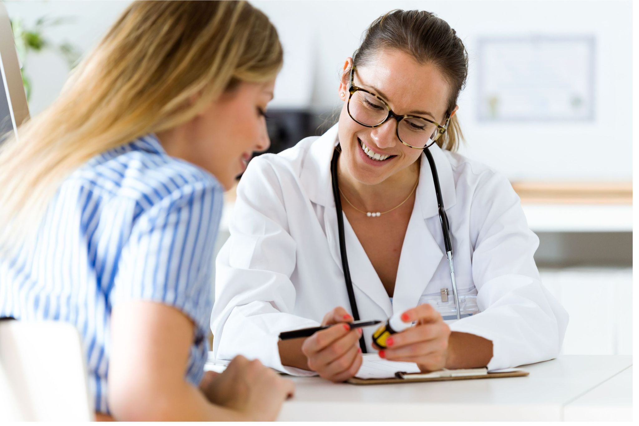 Doctor in welcoming consultation with patient